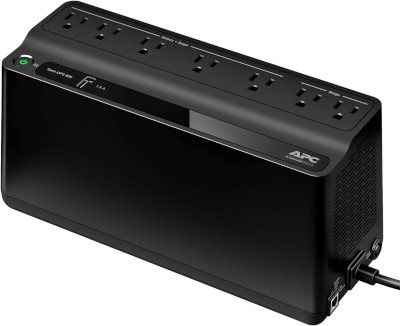 APC UPS battery backup next to Mac