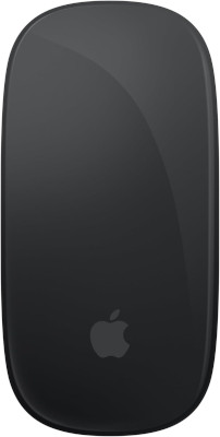 Apple Magic Mouse next to MacBook