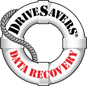 Technician recovering data from a damaged Mac hard drive using cleanroom tools